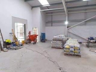 commercial liquid screed warehouse floor Wales